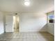 Spacious bedroom with tile flooring and an ensuite bathroom at 930 S Acapulco Ln # D, Tempe, AZ 85281