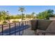 Balcony view of a quiet road lined with trees and lush greenery, providing a serene outdoor space at 10015 E Mountain View Rd # 2012, Scottsdale, AZ 85258