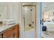 Bathroom with granite countertops, a shower and tub combination, and a view into an adjacent bedroom at 10015 E Mountain View Rd # 2012, Scottsdale, AZ 85258