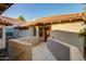 Exterior view of a cozy home featuring a red tile roof and a welcoming entrance, showcasing its charming curb appeal at 10015 E Mountain View Rd # 2012, Scottsdale, AZ 85258