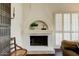 Close up of the white tiled fireplace in the living room area at 10015 E Mountain View Rd # 2012, Scottsdale, AZ 85258