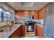 This well-equipped kitchen features stainless steel appliances, granite countertops, and ample cabinet space at 10015 E Mountain View Rd # 2012, Scottsdale, AZ 85258