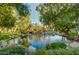 Scenic pond surrounded by lush trees and landscaping, offering a tranquil and picturesque view at 10015 E Mountain View Rd # 2012, Scottsdale, AZ 85258