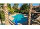 Overhead view of a sparkling pool with plenty of lounge chairs and umbrellas, perfect for relaxation and leisure at 10015 E Mountain View Rd # 2012, Scottsdale, AZ 85258
