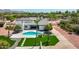 Aerial view of home with pool, patio, and lush landscaping at 10620 N 84Th St, Scottsdale, AZ 85260