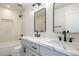 Bathroom with double sinks, marble countertops, and modern fixtures at 10620 N 84Th St, Scottsdale, AZ 85260