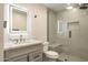 Bathroom featuring a glass shower and modern vanity with a marble countertop at 10620 N 84Th St, Scottsdale, AZ 85260