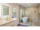 Stunning bathroom with glass shower, soaking tub, and modern fixtures for a spa-like experience at 10620 N 84Th St, Scottsdale, AZ 85260