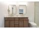 Modern bathroom with dual vanity, stylish fixtures, and white marble countertops at 10620 N 84Th St, Scottsdale, AZ 85260