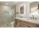 Bright bathroom featuring a glass enclosed shower and dual sink vanity at 10620 N 84Th St, Scottsdale, AZ 85260
