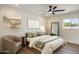 Airy bedroom with hardwood floors, decorative shelves, and comfortable seating at 10620 N 84Th St, Scottsdale, AZ 85260