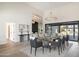 Open-concept dining room features soaring ceilings, modern decor, and seamless transition to backyard at 10620 N 84Th St, Scottsdale, AZ 85260