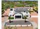 Large home with desert landscaping and gated driveway at 10620 N 84Th St, Scottsdale, AZ 85260