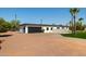 Property includes a spacious garage and meticulous landscaping, creating a visually appealing and functional space at 10620 N 84Th St, Scottsdale, AZ 85260
