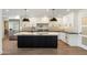 Stylish kitchen features white cabinets, dark countertops, modern fixtures, and stainless steel appliances at 10620 N 84Th St, Scottsdale, AZ 85260