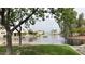 Scenic waterfront view of the tranquil community lake and fountain at 1132 E Harbor View Dr, Gilbert, AZ 85234