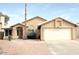 Charming single-story home featuring a two-car garage, desert landscaping, and a well-maintained front yard at 1132 E Harbor View Dr, Gilbert, AZ 85234