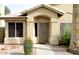 Inviting front entrance with desert landscaping, a secure door, and a walkway leading to the front door at 1132 E Harbor View Dr, Gilbert, AZ 85234