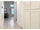 Hallway featuring white walls, white built-in storage cabinets and access to other rooms in the home at 1132 E Harbor View Dr, Gilbert, AZ 85234