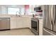 Well-lit kitchen featuring stainless steel appliances, modern fixtures, and ample counter space for cooking at 1132 E Harbor View Dr, Gilbert, AZ 85234
