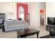 Bright living room featuring vaulted ceilings and open space with comfortable seating and access to the kitchen at 1132 E Harbor View Dr, Gilbert, AZ 85234