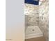 Walk-in shower featuring grab bars and a built-in shelf, designed for accessibility and convenience at 1132 E Harbor View Dr, Gilbert, AZ 85234