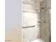 Shower with grab bars and a hand-held shower head for accessibility and convenience at 1132 E Harbor View Dr, Gilbert, AZ 85234