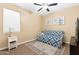 Relaxing bedroom with a sofa bed, neutral paint, carpeted floors, and natural light from the window at 13554 W Briles Rd, Peoria, AZ 85383