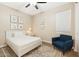 Comfortable bedroom featuring natural light, carpet floors, a neutral color scheme and a cozy reading nook at 13554 W Briles Rd, Peoria, AZ 85383