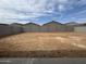 Spacious backyard featuring dirt ground, block fencing, and potential for landscaping and outdoor living at 15786 W Cheryl Dr, Waddell, AZ 85355