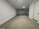 Spacious two car garage with automatic door and ample room for vehicles and storage at 15786 W Cheryl Dr, Waddell, AZ 85355