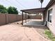 Spacious backyard featuring a covered patio area and block wall fencing at 17635 N 22Nd St, Phoenix, AZ 85022