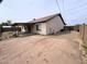 Rear exterior view of the home with a covered patio and ample parking space at 17635 N 22Nd St, Phoenix, AZ 85022