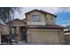 Two-story home featuring a neutral stucco exterior, tile roof, and an attached two-car garage at 4152 S 249Th Dr, Buckeye, AZ 85326