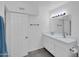 Bright bathroom featuring double sinks, a tile backsplash, and updated fixtures at 10245 N 15Th Dr, Phoenix, AZ 85021