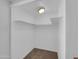 Walk-in closet featuring shelving and carpeted floor at 10245 N 15Th Dr, Phoenix, AZ 85021