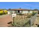Quaint single-story home with tidy desert landscaping, a mailbox, and a paved driveway at 10245 N 15Th Dr, Phoenix, AZ 85021