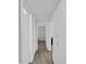 Bright hallway with wood floors, white cabinets and doors providing ample natural light at 10245 N 15Th Dr, Phoenix, AZ 85021