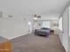 Spacious bedroom featuring a fan, lots of carpet, lots of windows and natural light at 10245 N 15Th Dr, Phoenix, AZ 85021