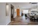 Spacious entryway with wood-look flooring, leading to an open-concept living and dining area with lots of natural light at 10423 E Verbena Ln, Scottsdale, AZ 85255