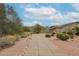 Charming home featuring desert landscaping, a winding walkway, and scenic mountain views at 10423 E Verbena Ln, Scottsdale, AZ 85255