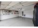 Bright garage with epoxy floors, water filtration system, and ample storage at 10423 E Verbena Ln, Scottsdale, AZ 85255