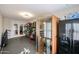 Brightly lit gym with multiple work out machines, an infrared sauna and a refrigerator at 10423 E Verbena Ln, Scottsdale, AZ 85255