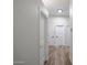 Hallway with wood floors and white doors at 10423 E Verbena Ln, Scottsdale, AZ 85255