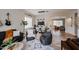 Cozy living space with comfortable seating, a stylish rug, and an open view to the dining area for easy entertaining at 10423 E Verbena Ln, Scottsdale, AZ 85255
