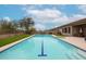 Backyard swimming pool with blue waterline tiles and an extended patio for outdoor enjoyment at 10423 E Verbena Ln, Scottsdale, AZ 85255