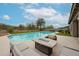 Inviting pool area with comfortable seating and a fire pit, perfect for outdoor relaxation and entertainment at 10423 E Verbena Ln, Scottsdale, AZ 85255