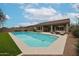 Beautiful backyard pool and patio area with modern landscaping and outdoor seating arrangements at 10423 E Verbena Ln, Scottsdale, AZ 85255