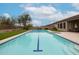 A pristine pool featuring a center blue stripe, offering a refreshing oasis for relaxation and exercise at 10423 E Verbena Ln, Scottsdale, AZ 85255