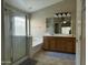 Well-lit bathroom with a shower, bathtub, and double sink vanity with ample counter space at 11570 W Pima St, Avondale, AZ 85323